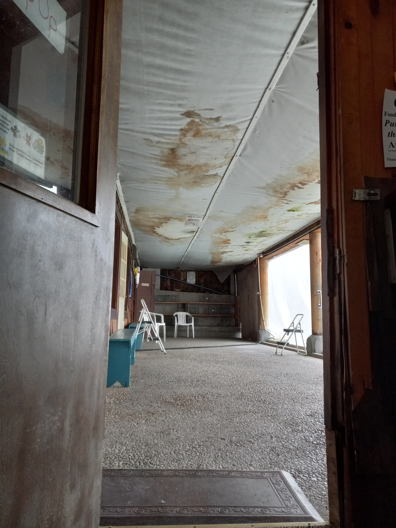 Porch ceiling near doorway before work